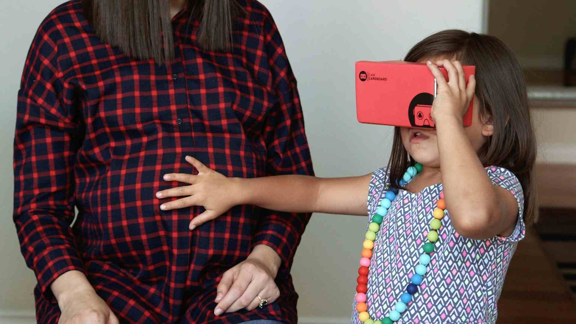 Mother and child with VR glasses on